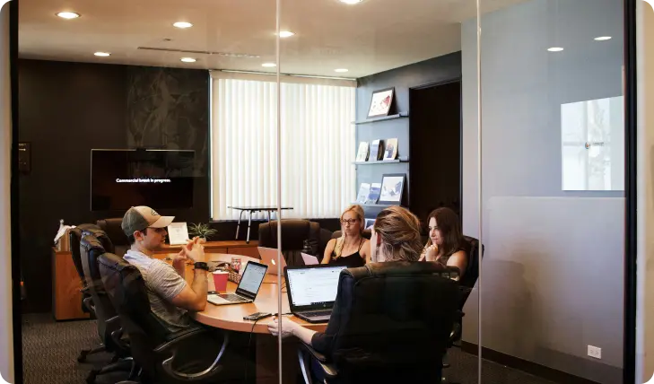 A professional handshake with a contract, symbolizing trust and security in business insurance.