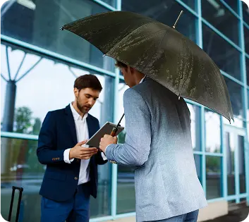 Business professionals reviewing commercial general liability insurance policy