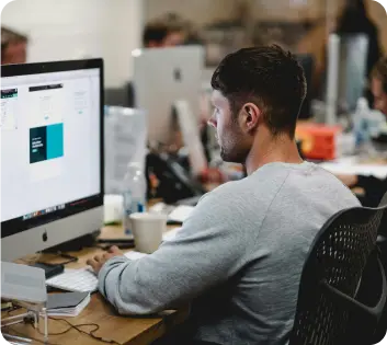 A diverse team of professionals working in a modern office, representing a variety of business types.